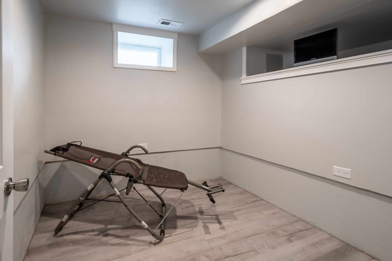 207 East Custer Street Lemont, IL 60439 - Photo 23 of 27 a view of a room with rack on the wall and a window