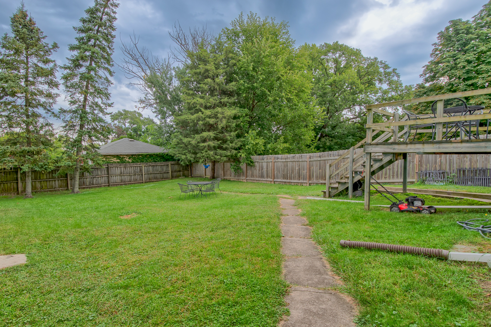 207 East Custer Street Lemont, IL 60439 - Photo 26 of 27 a view of a house with a backyard and a tree
