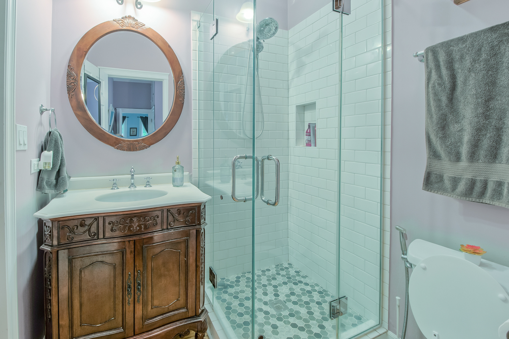 207 East Custer Street Lemont, IL 60439 - Photo 10 of 27 a bathroom with a mirror a sink and a mirror