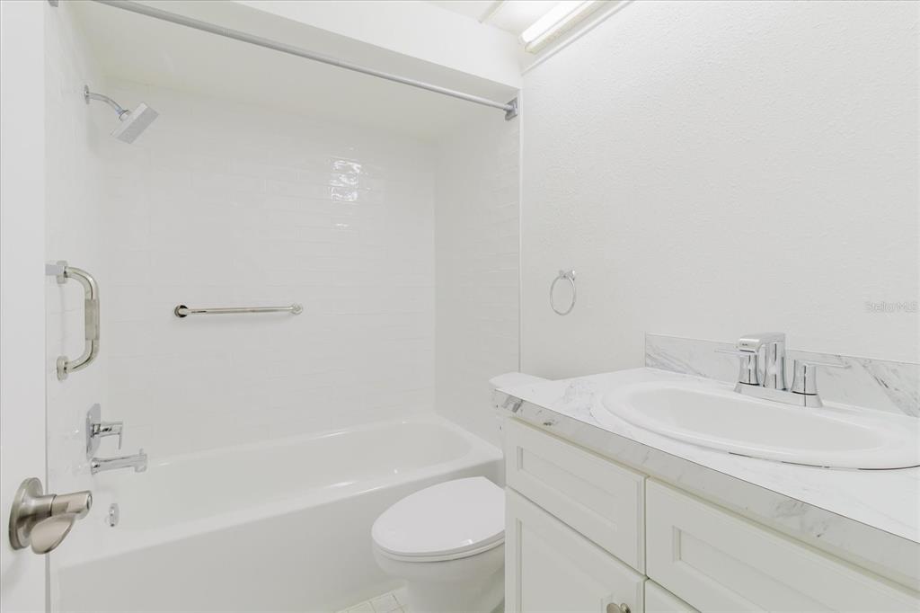 4235 Stratford Drive New Port Richey, FL 34652 - Photo 17 of 32 a bathroom with a sink a toilet and a bathtub