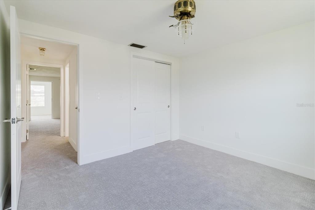 4235 Stratford Drive New Port Richey, FL 34652 - Photo 19 of 32 a view of a room with a fan