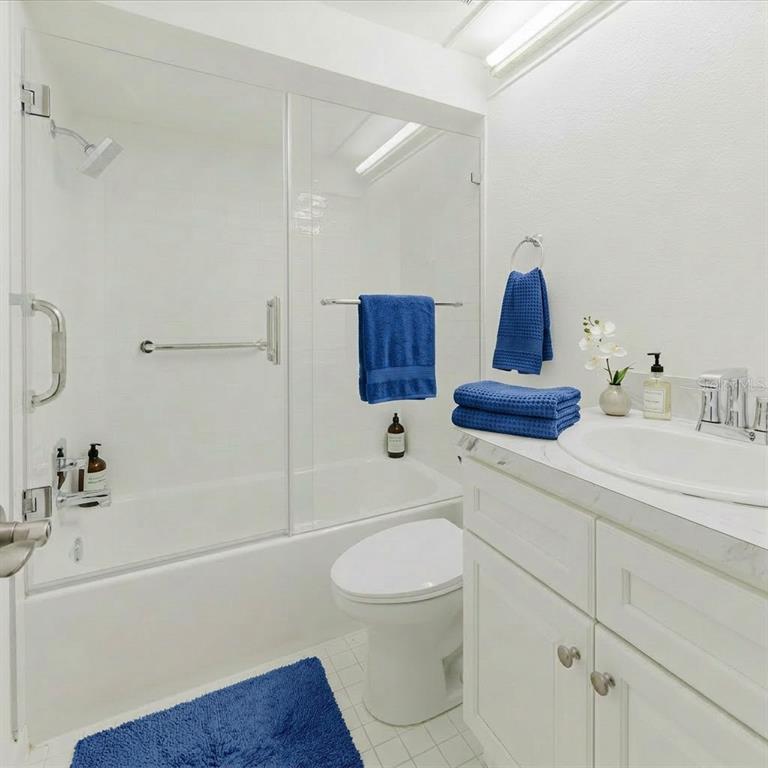 4235 Stratford Drive New Port Richey, FL 34652 - Photo 20 of 36 a bathroom with a bathtub sink vanity and toilet