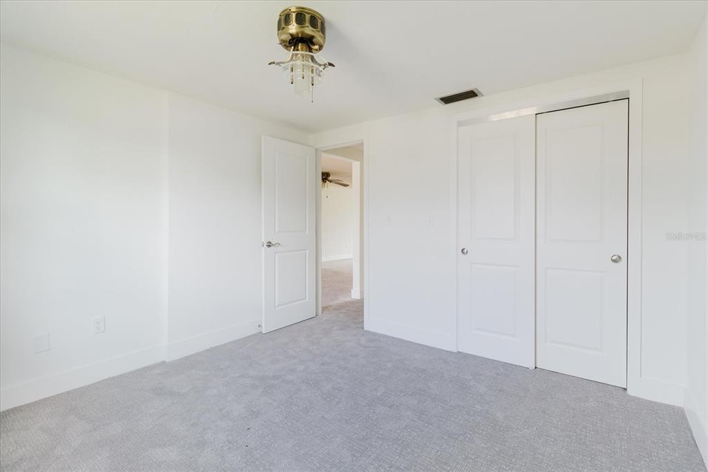 4235 Stratford Drive New Port Richey, FL 34652 - Photo 22 of 36 a view of a room with a fan