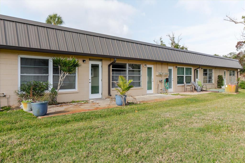 4235 Stratford Drive New Port Richey, FL 34652 - Photo 24 of 36 a view of a house with backyard porch and sitting area