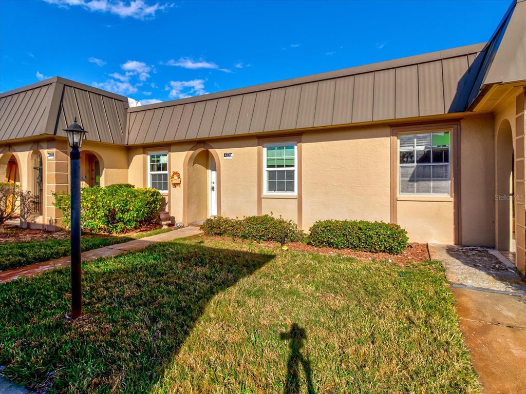 4235 Stratford Drive New Port Richey, FL 34652 - Photo 28 of 36 a view of a house with backyard and sitting area