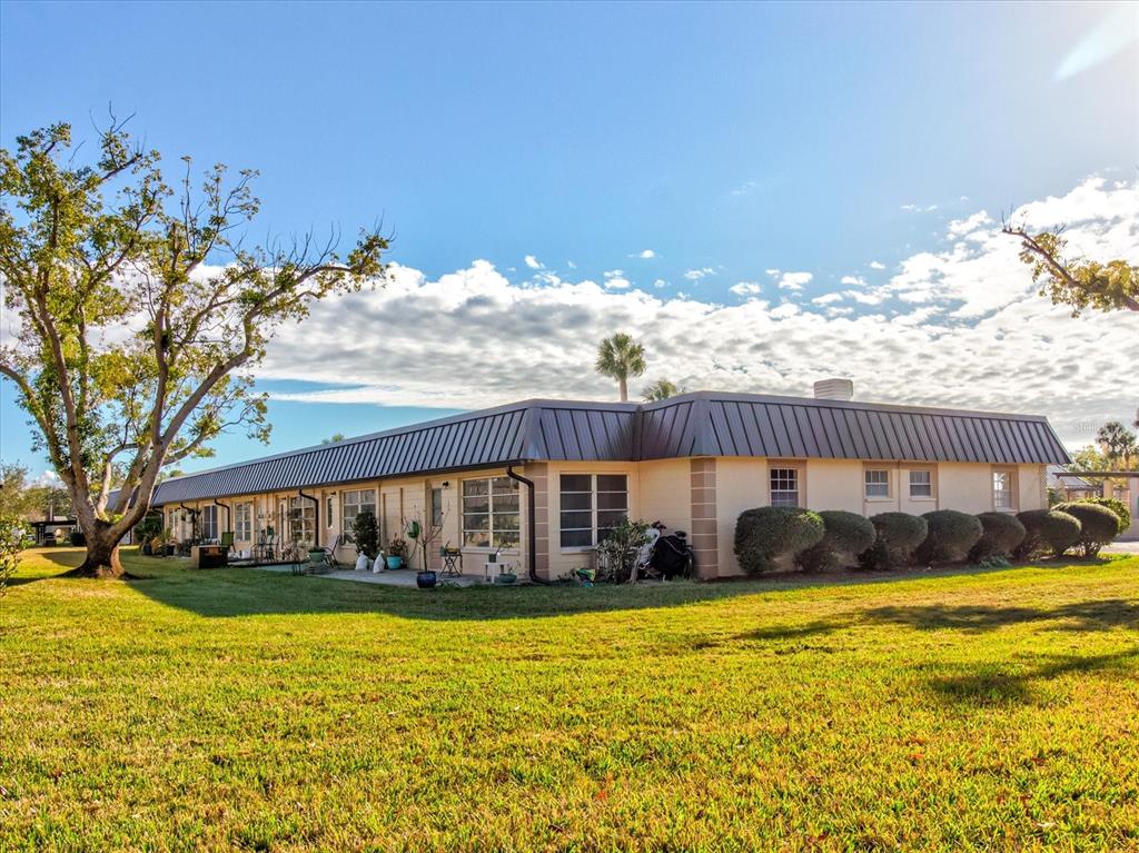 4235 Stratford Drive New Port Richey, FL 34652 - Photo 29 of 32 a view of a house with a swimming pool