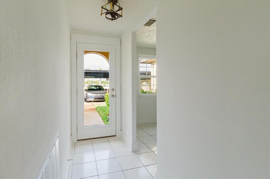 4235 Stratford Drive New Port Richey, FL 34652 - Photo 4 of 32 a view of an entryway and wooden floor