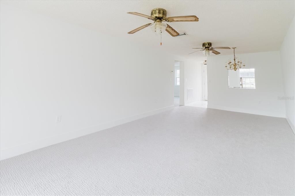 4235 Stratford Drive New Port Richey, FL 34652 - Photo 8 of 32 a view of a small space with a chandelier fan