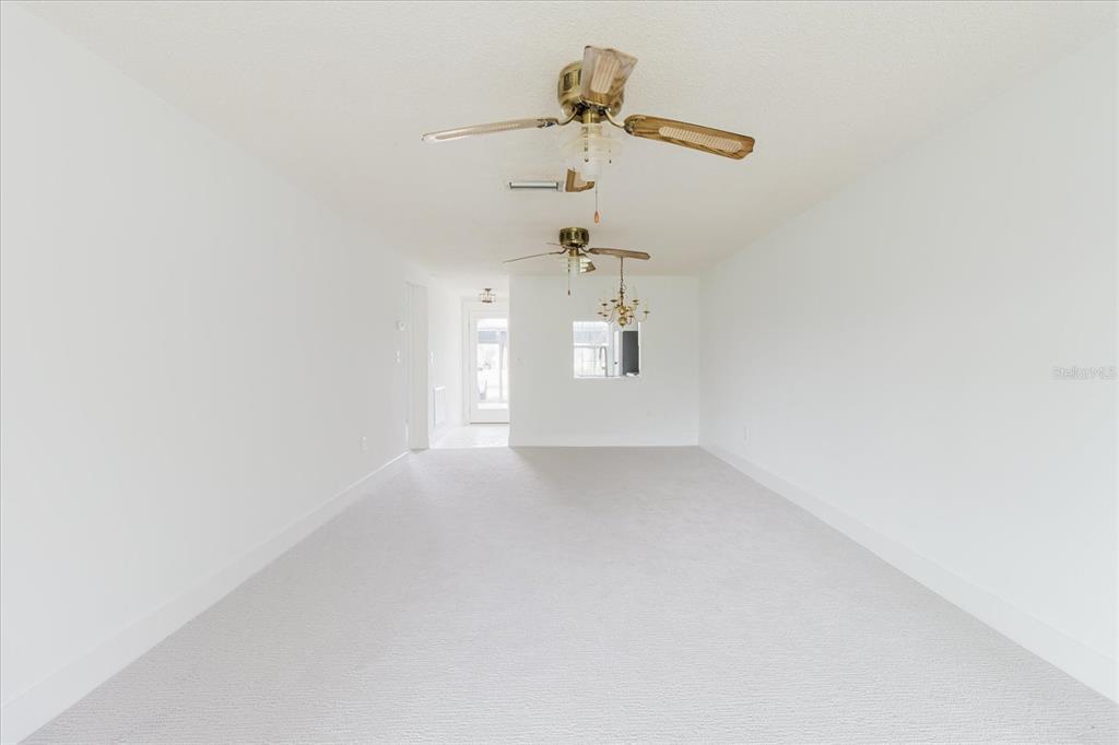 4235 Stratford Drive New Port Richey, FL 34652 - Photo 9 of 32 a view of a hallway with a window