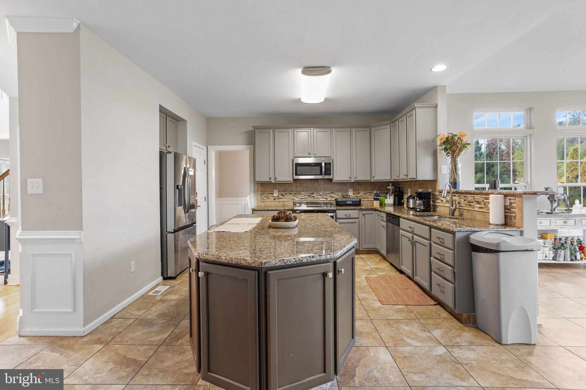 44 Red Fox Trail Sicklerville, NJ 08081 - Photo 18 of 49 a kitchen with stainless steel appliances granite countertop a sink stove and refrigerator