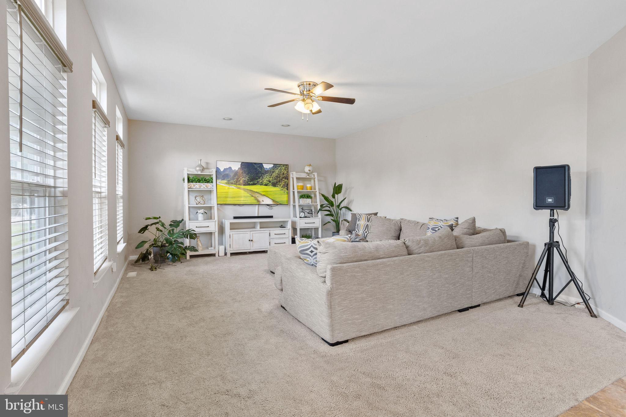 44 Red Fox Trail Sicklerville, NJ 08081 - Photo 21 of 49 a living room with furniture and a chandelier