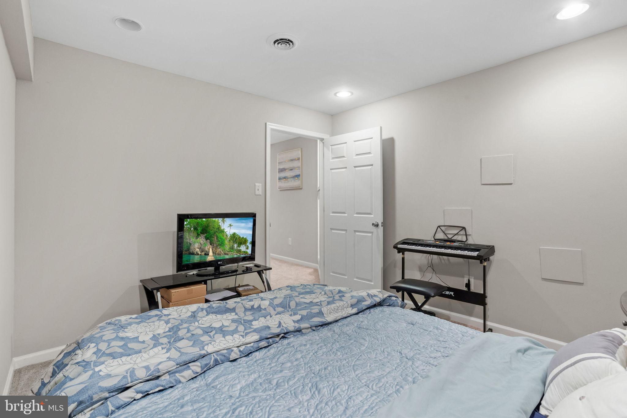 44 Red Fox Trail Sicklerville, NJ 08081 - Photo 27 of 49 a bedroom with a bed and a flat screen tv