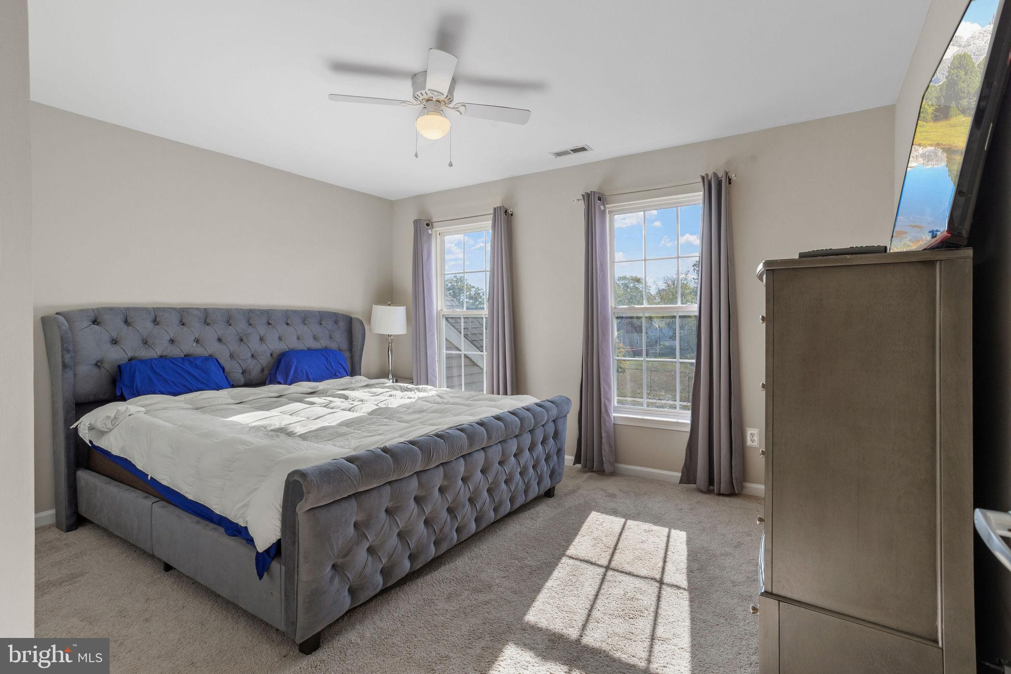 44 Red Fox Trail Sicklerville, NJ 08081 - Photo 29 of 49 a bedroom with a large bed and a chandelier