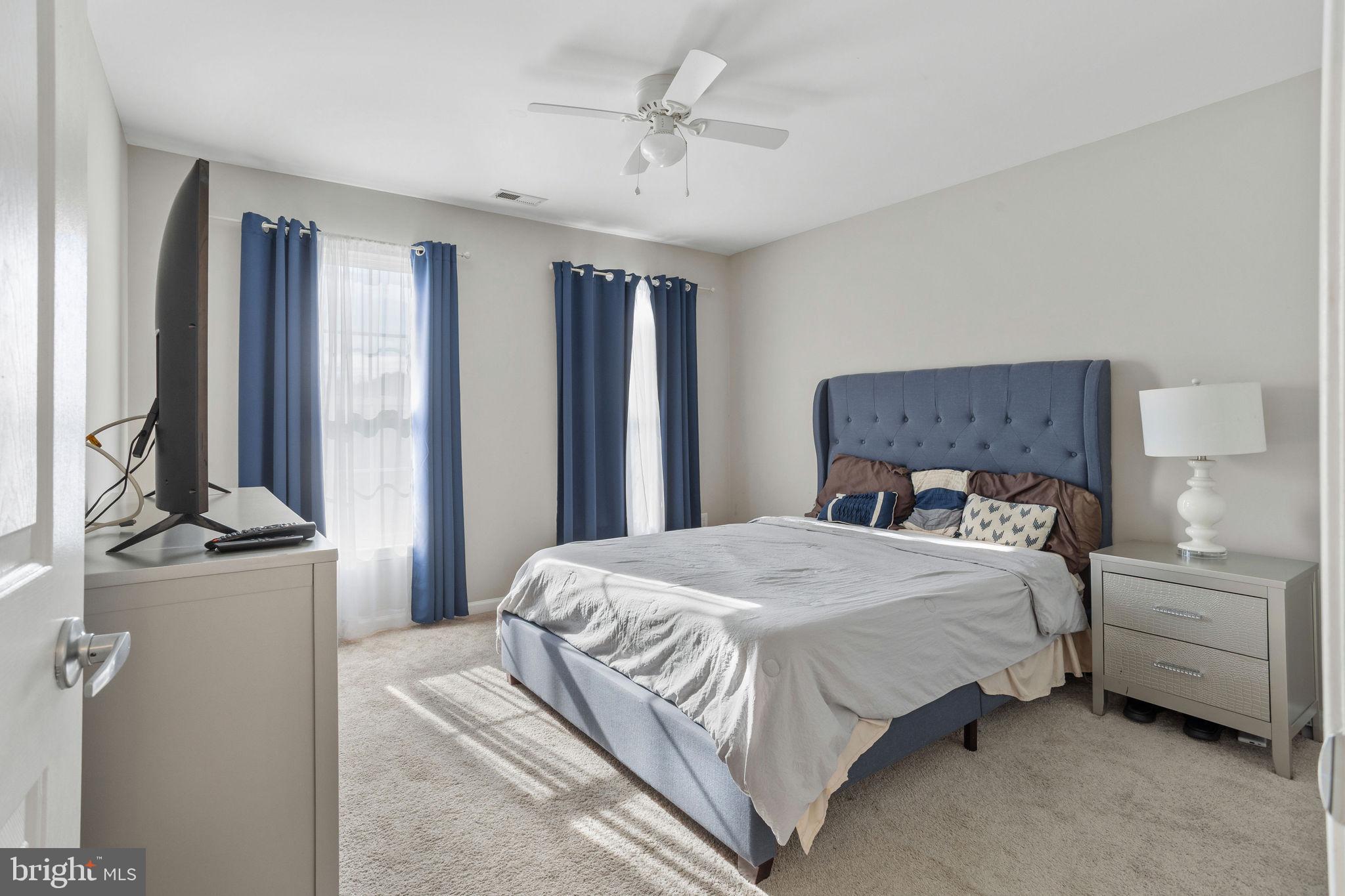 44 Red Fox Trail Sicklerville, NJ 08081 - Photo 33 of 49 a bedroom with a bed and a chandelier