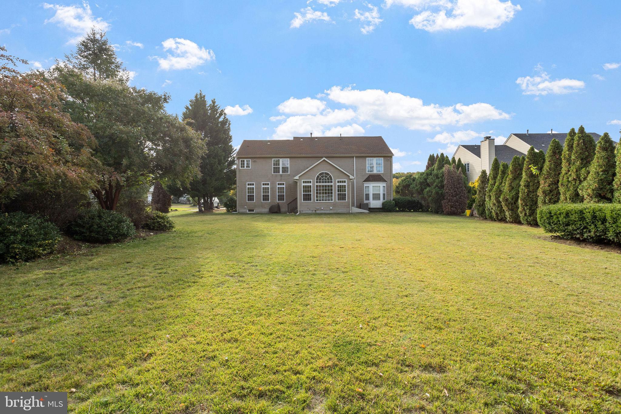 44 Red Fox Trail Sicklerville, NJ 08081 - Photo 43 of 49 a view of a lake with a house in the background