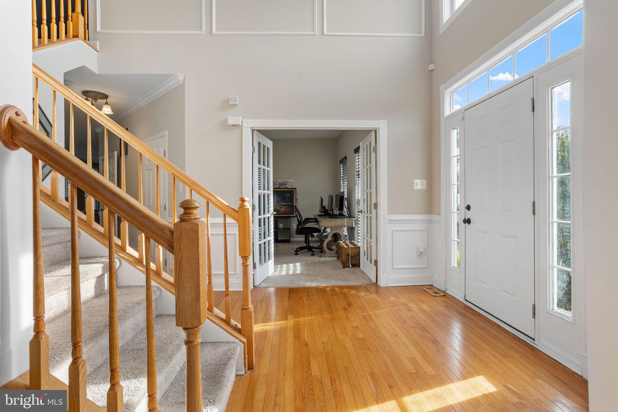 44 Red Fox Trail Sicklerville, NJ 08081 - Photo 6 of 49 a view of a livingroom with wooden floor and stairs