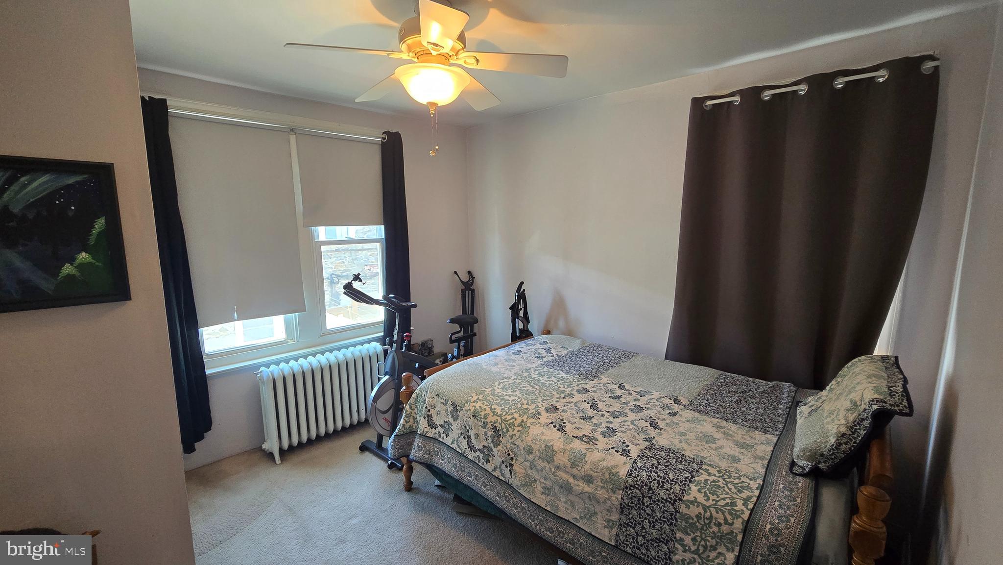 4606 Smick Street Philadelphia, PA 19127 - Photo 16 of 21 a bedroom with a bed and a window