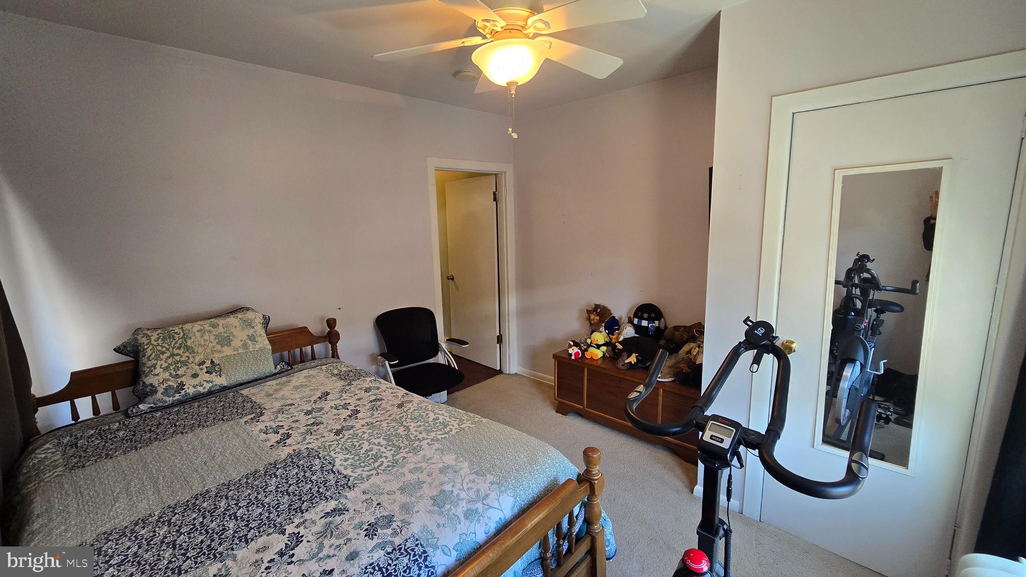 4606 Smick Street Philadelphia, PA 19127 - Photo 17 of 21 a bedroom with bed and a chandelier