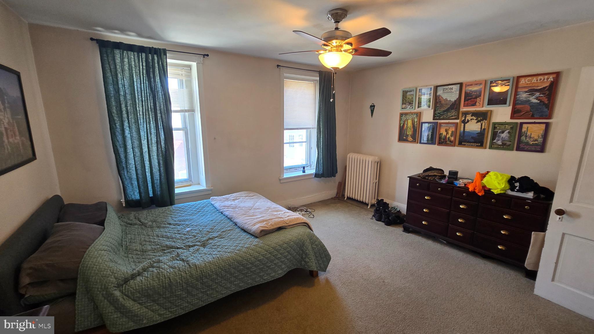 4606 Smick Street Philadelphia, PA 19127 - Photo 20 of 21 a bedroom with a bed dresser and window