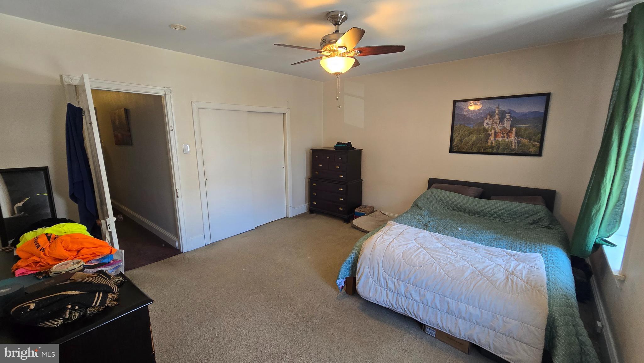 4606 Smick Street Philadelphia, PA 19127 - Photo 21 of 21 a bedroom with a bed and a chandelier