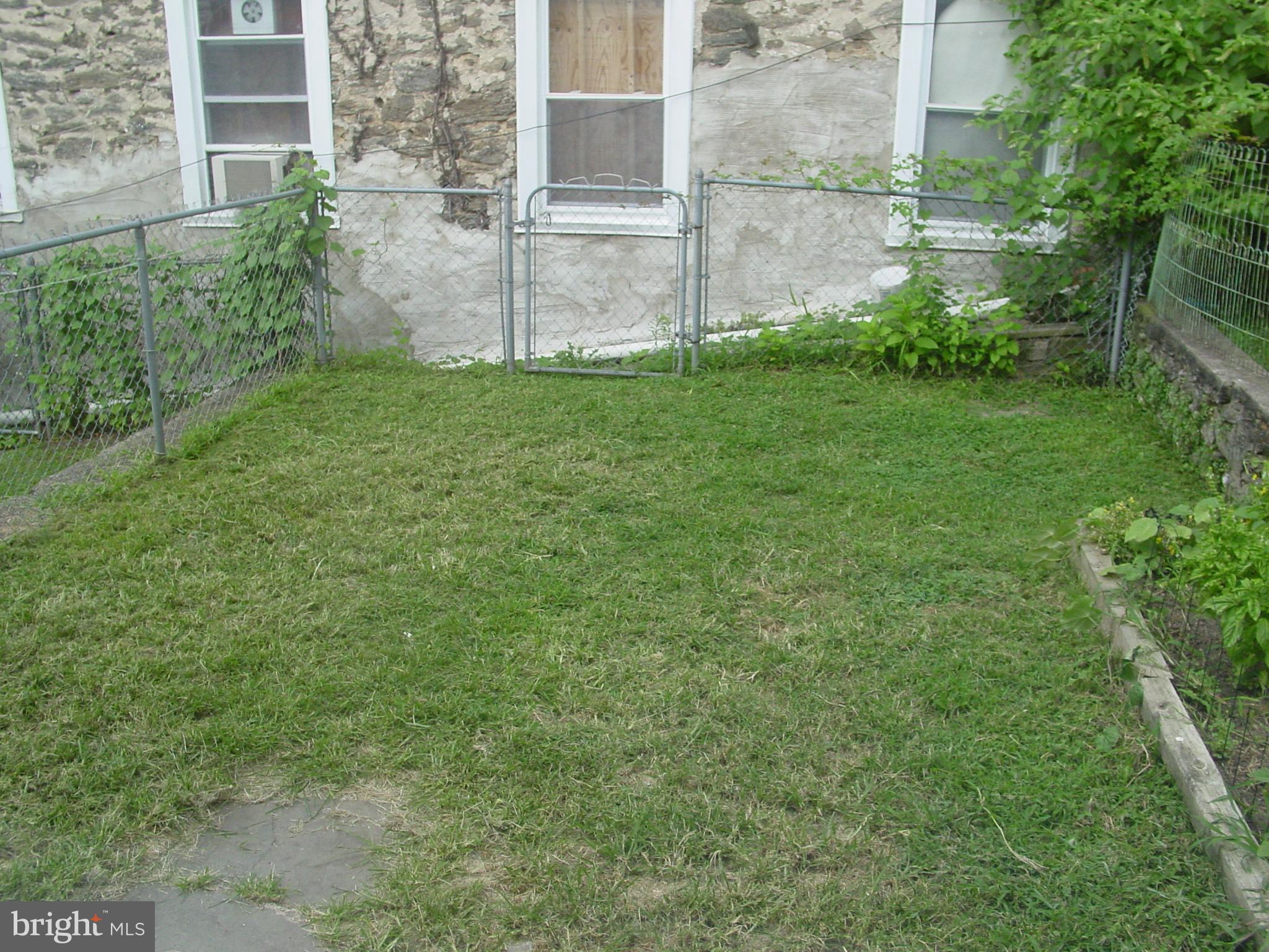 4606 Smick Street Philadelphia, PA 19127 - Photo 4 of 21 a view of a backyard with a garden