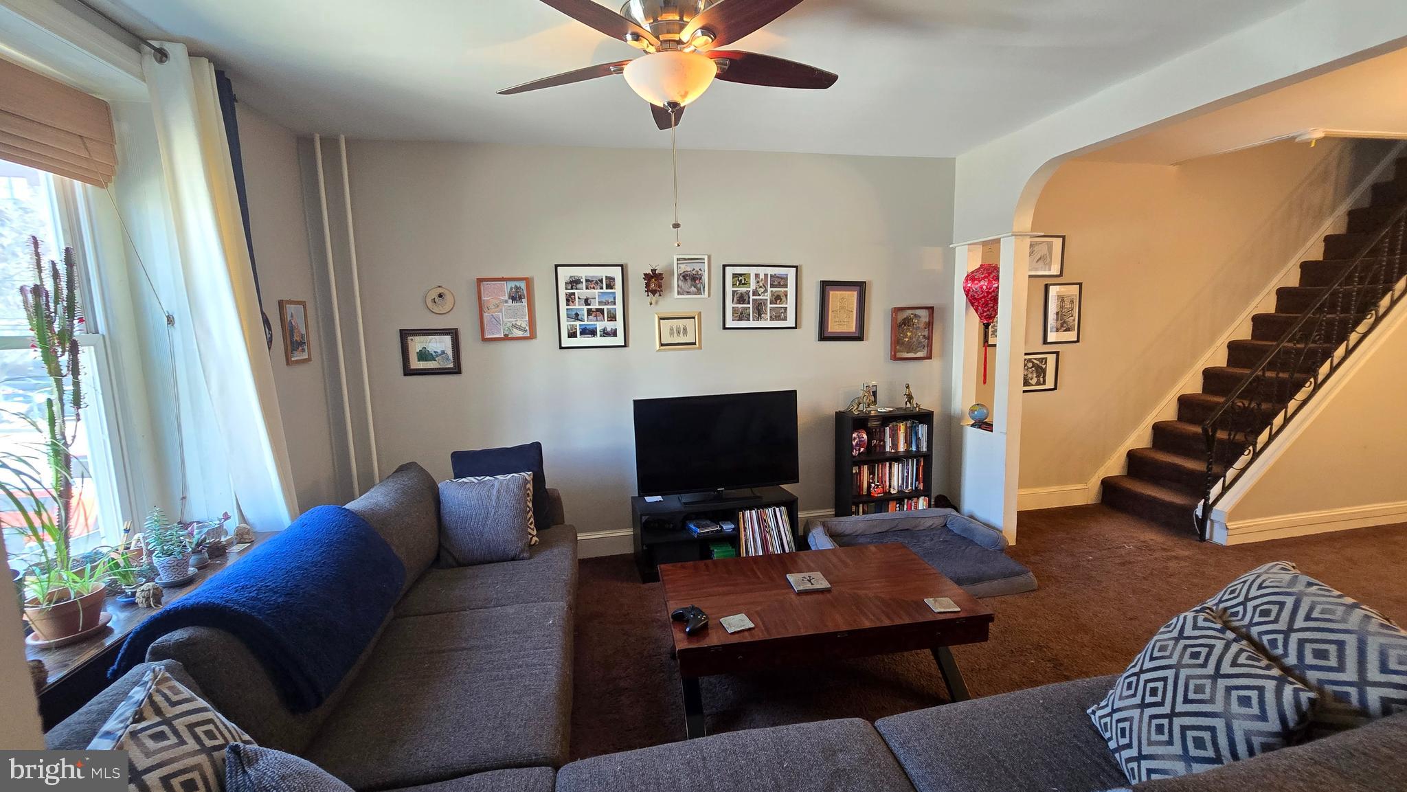 4606 Smick Street Philadelphia, PA 19127 - Photo 6 of 21 a living room with furniture a flat screen tv and a window