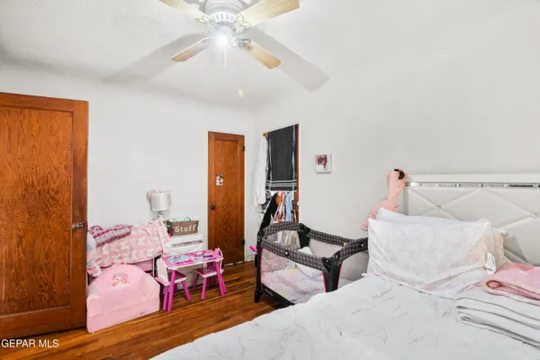 a bedroom with furniture and a chandelier