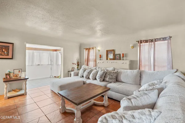 a living room with furniture and a table