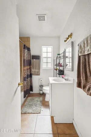 a room with a washing machine and sink
