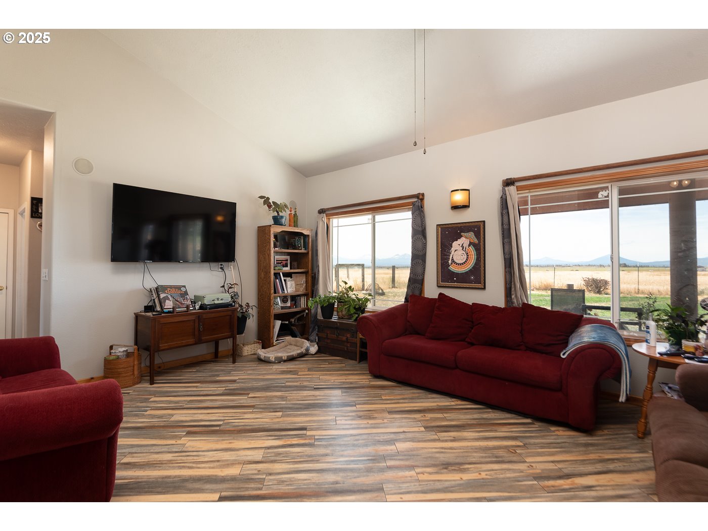 15990 Southwest Culver Highway Culver, OR 97734 - Photo 11 of 41 a living room with furniture flat screen tv and a large window