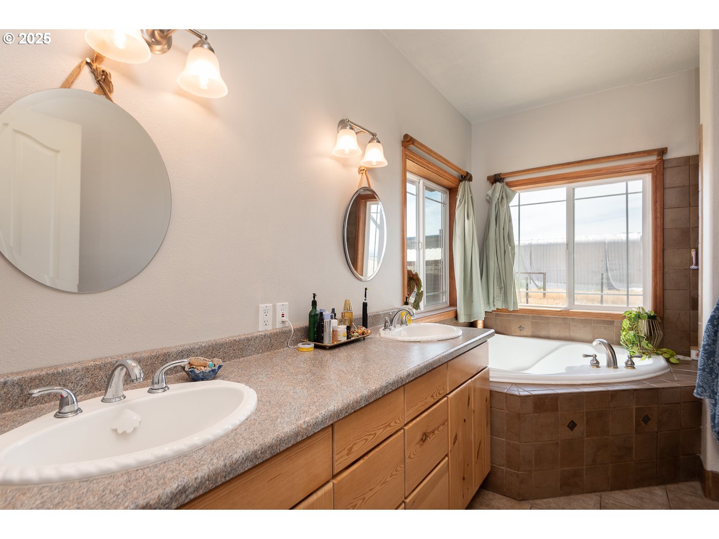 15990 Southwest Culver Highway Culver, OR 97734 - Photo 13 of 41 a bathroom with a double vanity sink and a mirror