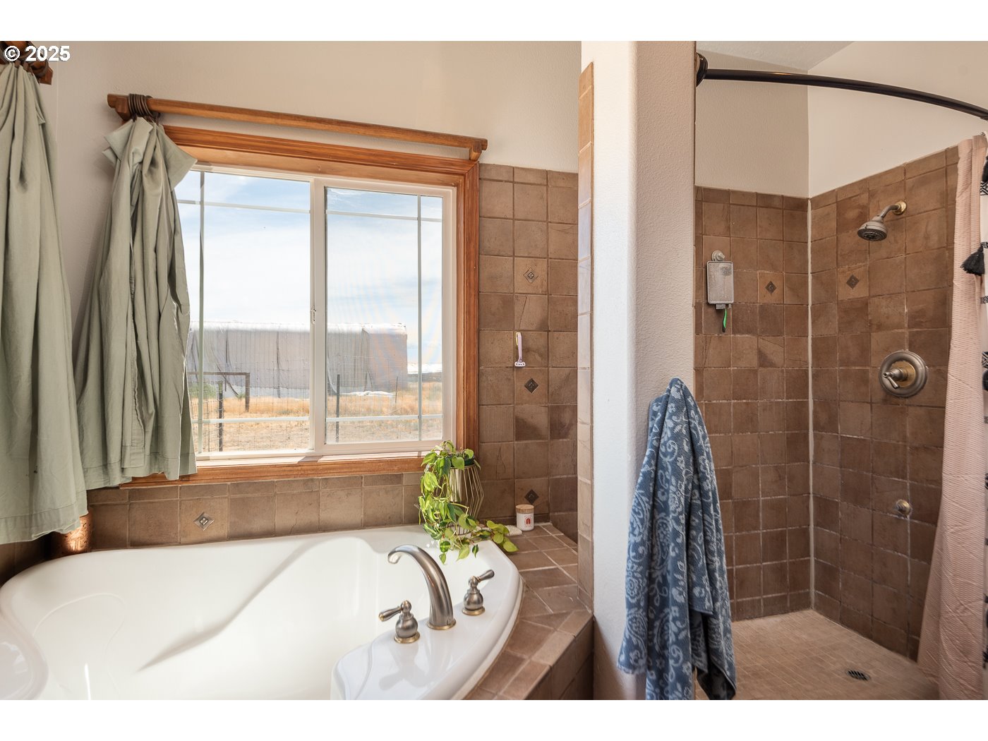15990 Southwest Culver Highway Culver, OR 97734 - Photo 14 of 41 a bathroom with a bathtub and a shower