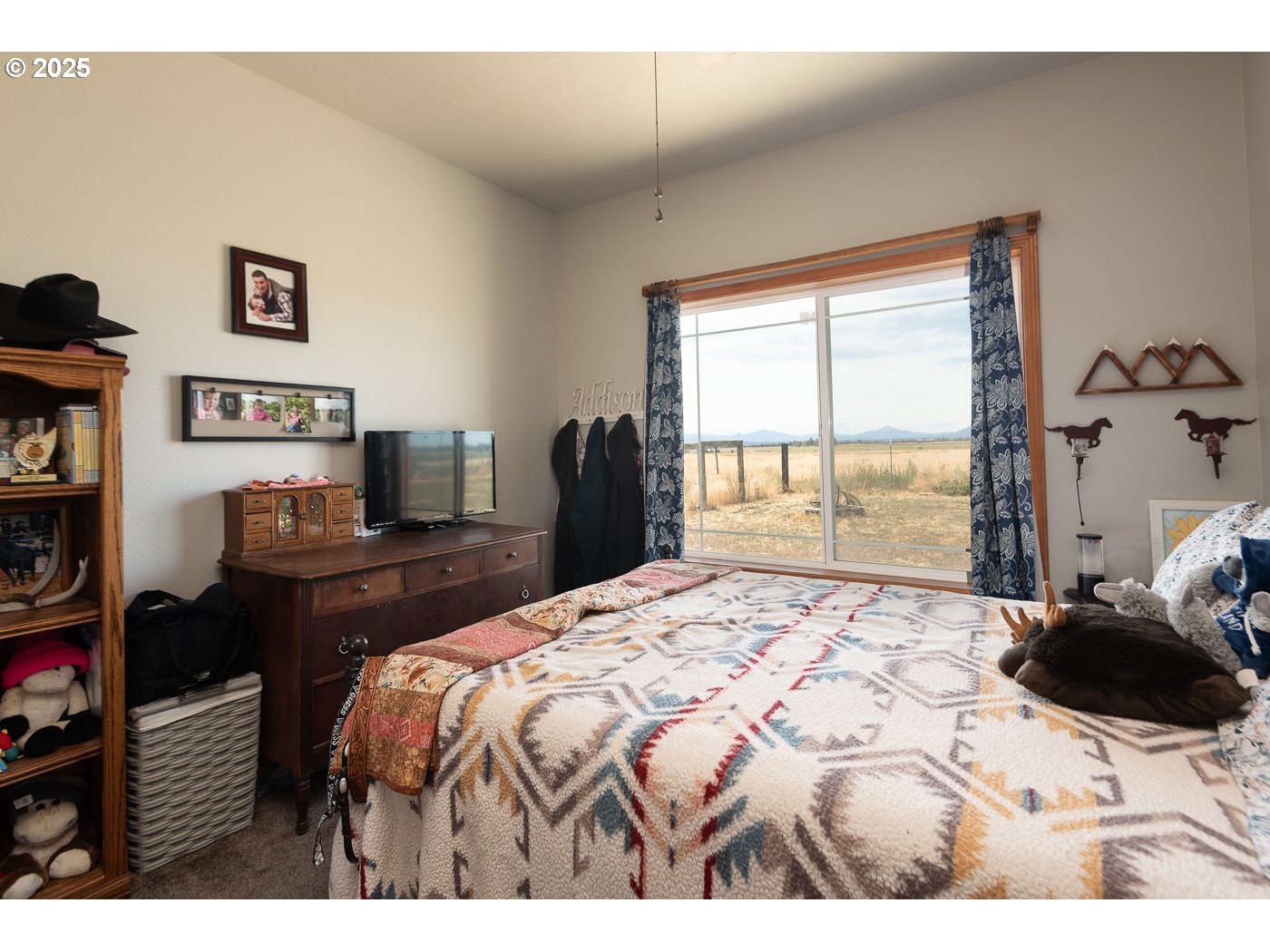 15990 Southwest Culver Highway Culver, OR 97734 - Photo 15 of 41 a bedroom with a bed and wooden floor