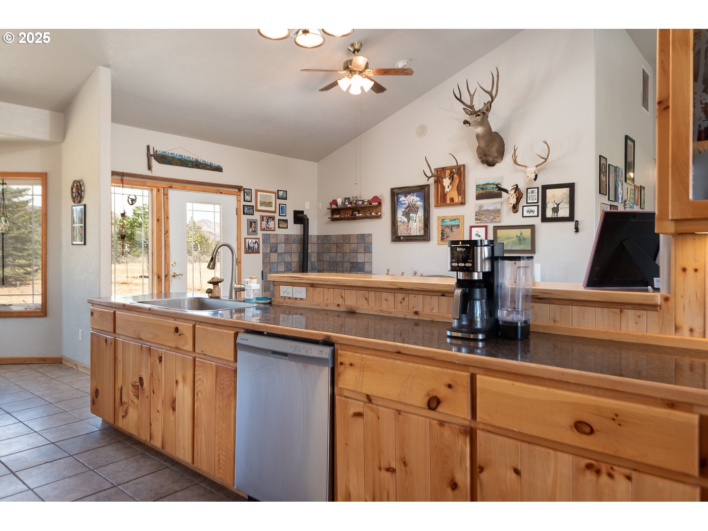 15990 Southwest Culver Highway Culver, OR 97734 - Photo 6 of 41 a kitchen with cabinets a sink and a stove
