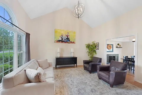 a spacious bedroom with a bed and a fireplace