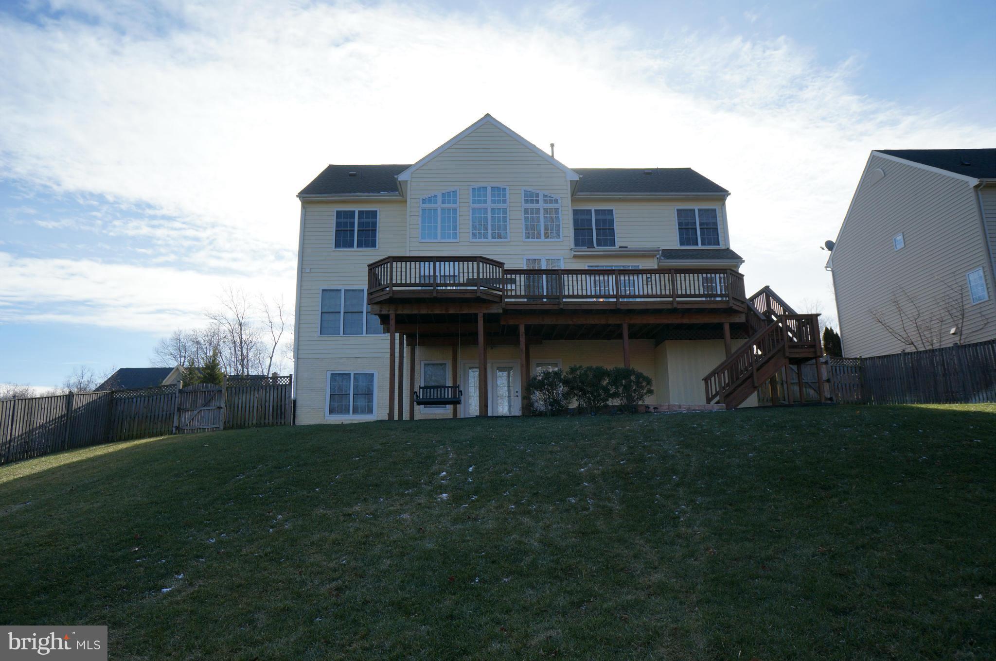 18504 Kerill Road Triangle, VA 22172 - Photo 27 of 30 Rear Facade with Expansive Deck