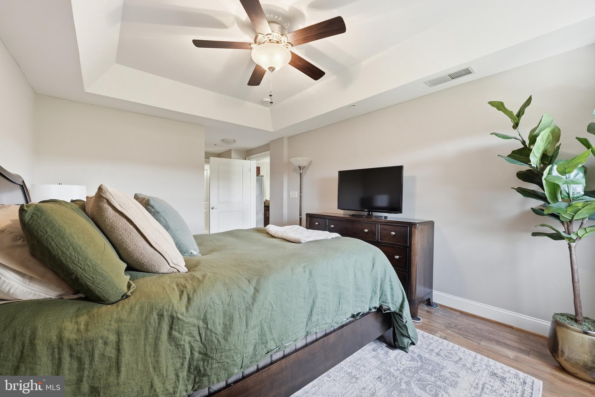 6301 Edsall Road, Unit 519 Alexandria, VA 22312 - Photo 19 of 33 a bedroom with a bed and a flat screen tv
