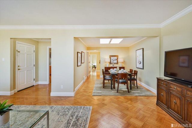 a view of a livingroom with furniture and a flat screen tv
