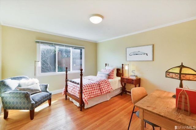 a bedroom with 2 bed and a couch