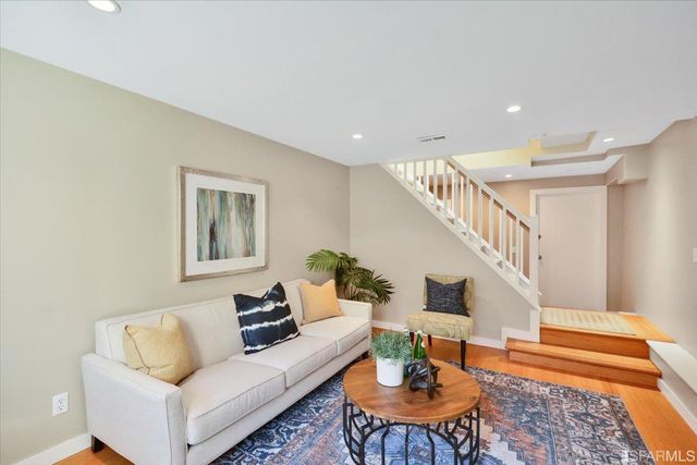 a living room with furniture and a table