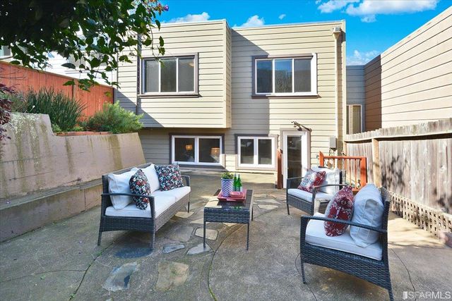 a outdoor living space with furniture and garden