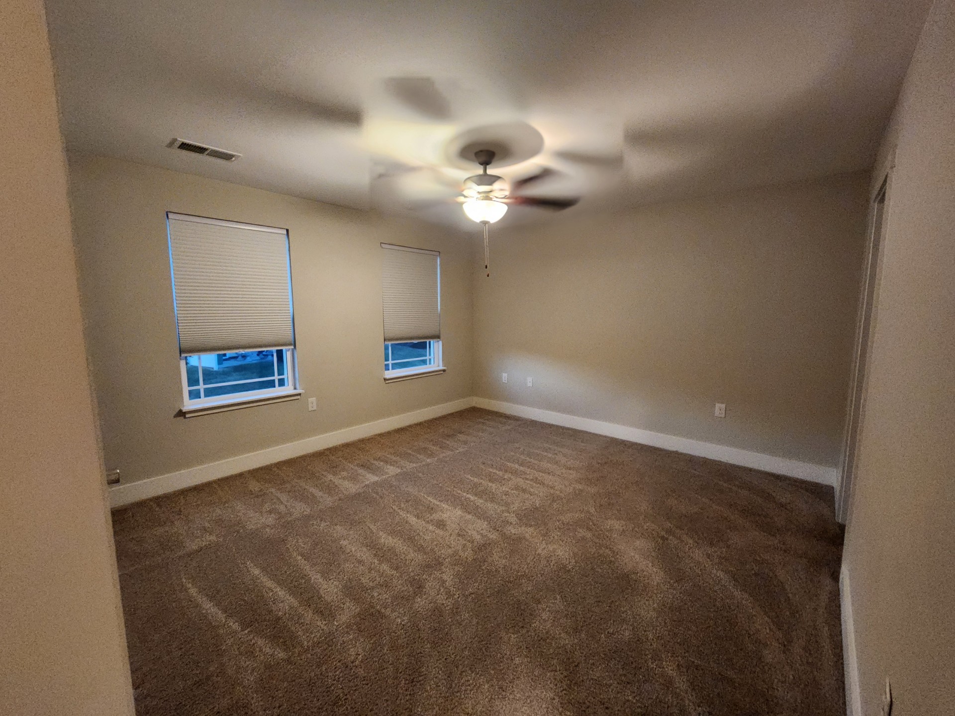 7002 Magnolia Crossings Spring Hill, TN 37174 - Photo 11 of 15 an empty room with windows and fan
