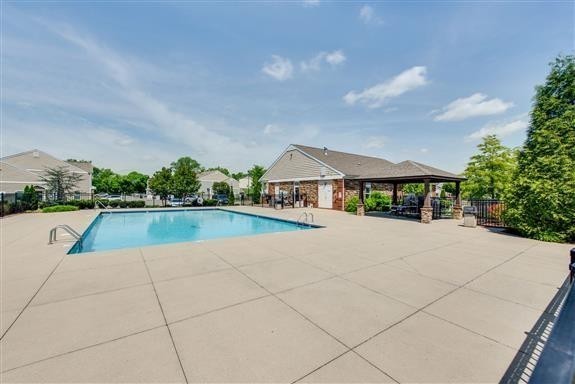 7002 Magnolia Crossings Spring Hill, TN 37174 - Photo 5 of 15 a view of house with swimming pool and a yard