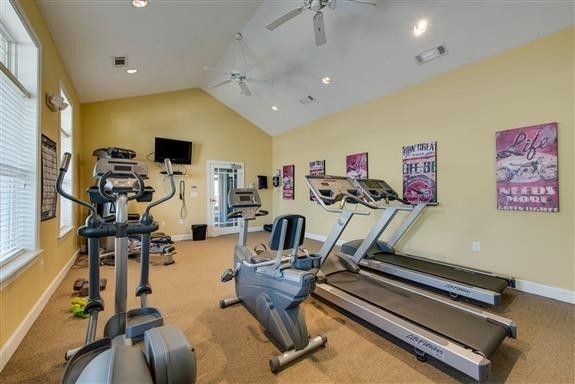 7002 Magnolia Crossings Spring Hill, TN 37174 - Photo 9 of 15 a room with gym equipment and a flat screen tv
