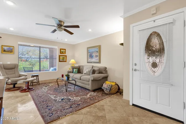 a living room with furniture and a rug