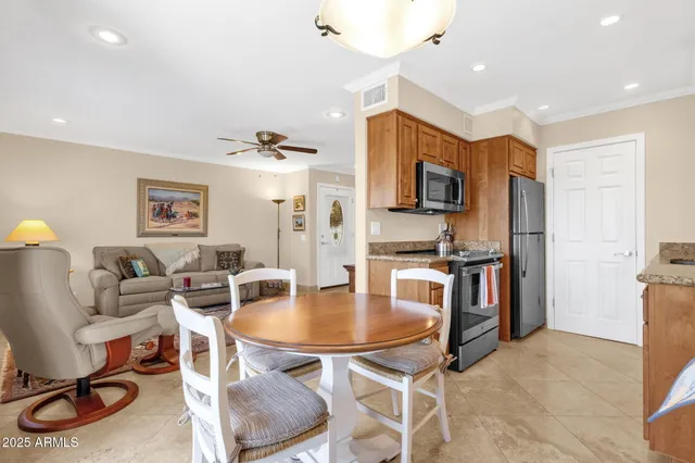 a view of a dining room with furniture window and outside view