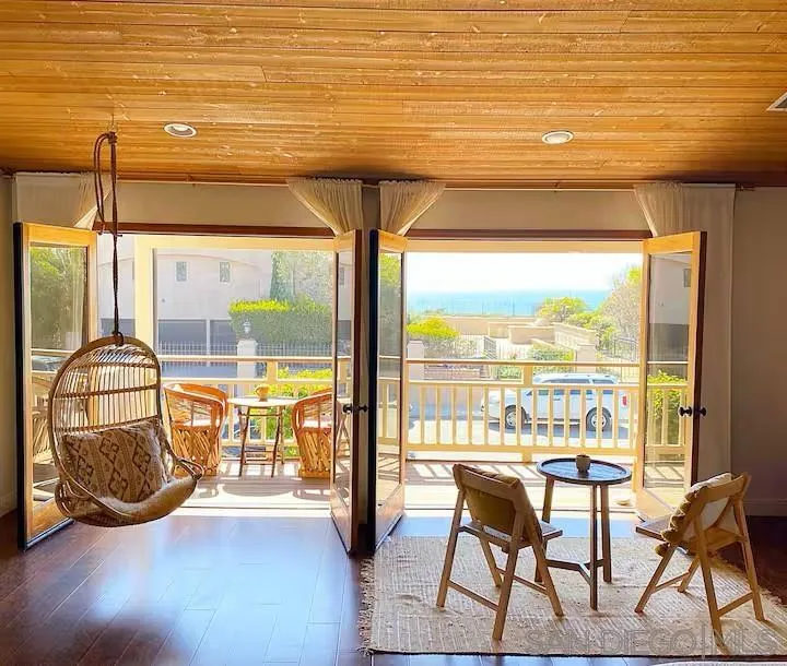 a view of a swimming pool with furniture