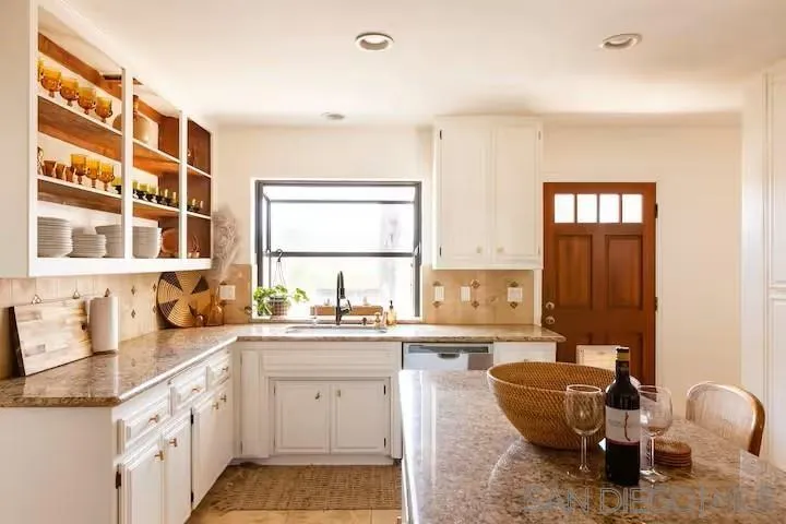 837 4th Street Encinitas, CA 92024 - Photo 13 of 41 a kitchen with sink cabinets and window