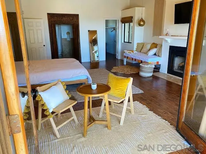 837 4th Street Encinitas, CA 92024 - Photo 19 of 41 a view of a livingroom with furniture and a fireplace