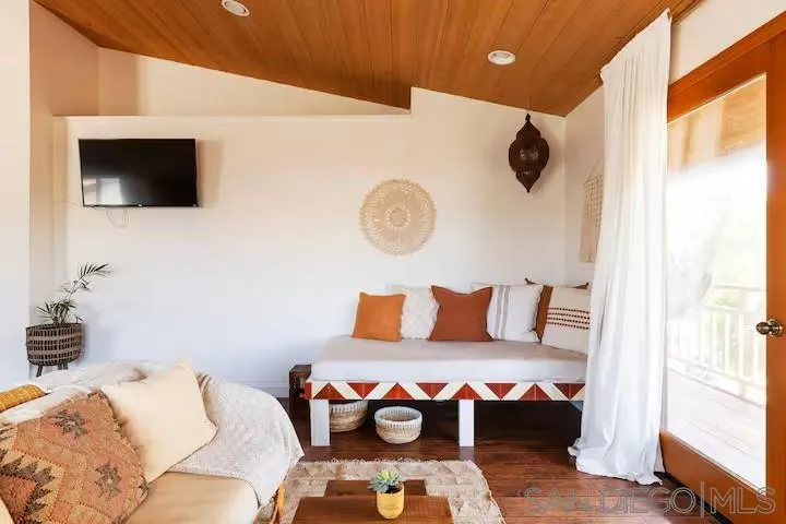 837 4th Street Encinitas, CA 92024 - Photo 27 of 41 a bedroom with a bed and a flat screen tv